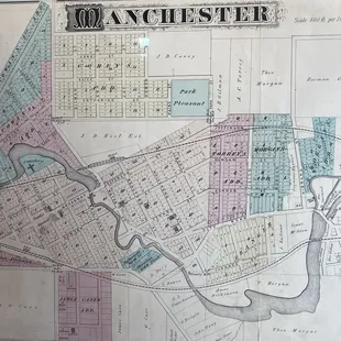 The décor includes an antique map of Manchester