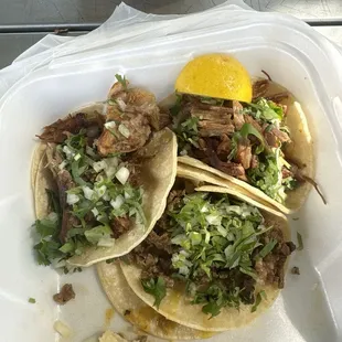 Three tacos, asada and carnitas. (I already had eaten one, oops).