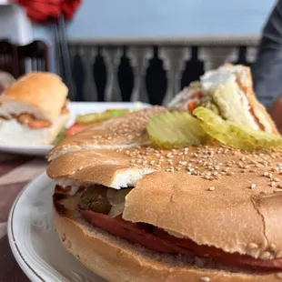 Muffuletta and shrimp po boy in the background.