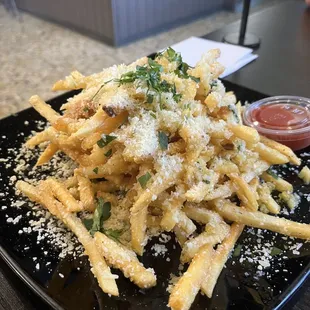 Garlic fries from PorQue No Tacos inside Frank's Sports Bar and Grill