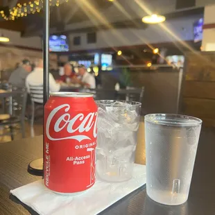 a can of coke and a glass of water