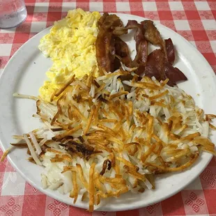 Scrambled eggs with bacon. Hash browns ordered separately.