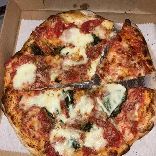 Pizza margherita with one slice of marinara pizza.