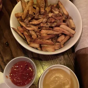 a bowl of fries and ketchup