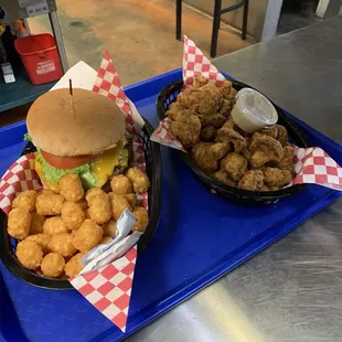 The just a burger with cheddar cheese and tots, with a side of fried mushrooms