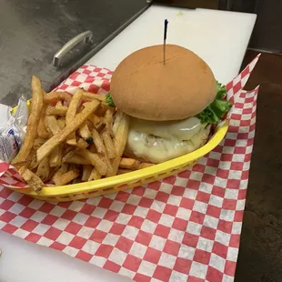 Avocado burger with Swiss cheese and home made fries.