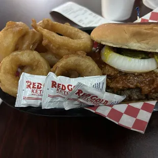 Chili cheese burger with onion rings.