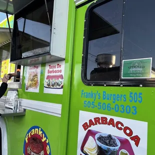 a man ordering food from a food truck