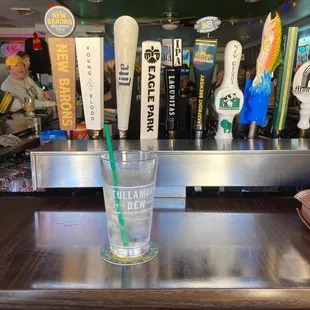 a glass of water with a straw