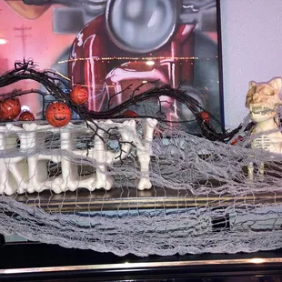 a skeleton sitting on top of a table