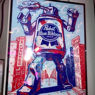 a beer bottle hanging from a chain