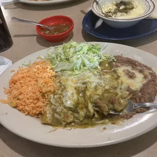 Green Chili cheese enchilada's, the queso fundido, and smothered chicken burrito