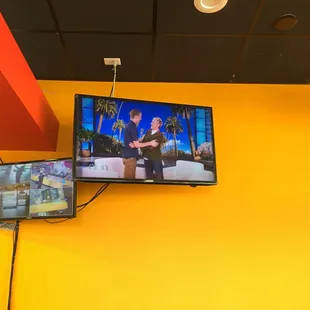 two televisions on the wall