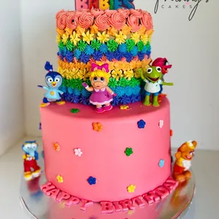 Muppet babies cake, bottom part is made out of fondant with gum paste flowers and the top is made out of buttercream with an edible topper.