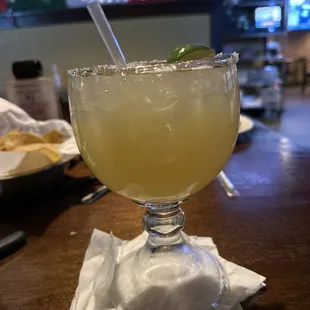 a margarita in a glass on a napkin