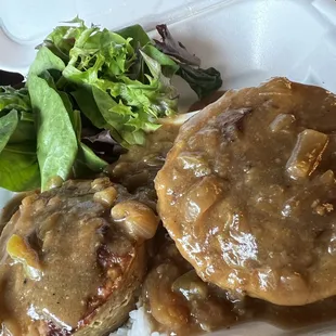 Smoked meatloaf and gravy served over rice