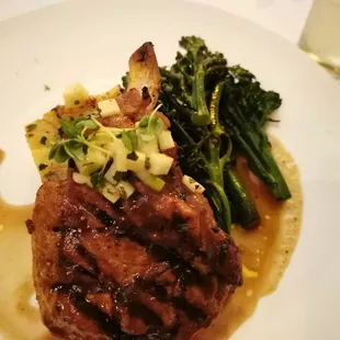 Very good pork chop entree, broccolini, Scalloped potatoes, and pan jus
