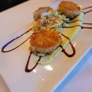 Crab cakes with wasabi sauce.