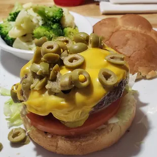 Fraser's burger with cheese and green olives