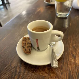 Espresso with a bite of biscotti