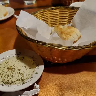 bread and olive oil on plate  for dipping