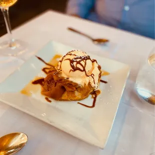 Homemade apple tart served with Italian vanilla gelato