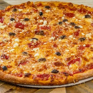 Our Mediterranean Pizza is topped with mozzarella cheese, feta cheese, Kalamata olives and roasted red peppers.