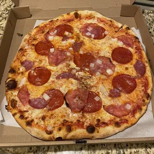 Large pepperoni, capicola, salami, and onions.