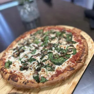 a pizza on a wooden board