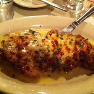 Veal Giuseppe, lightly breaded stuffed with crabmeat, layered with mozzarella and Fratello&apos;s Meniere sauce. Mouth watering!