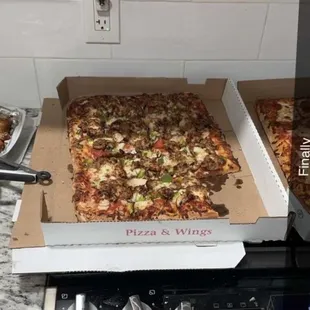Half sheet supreme and half sheet pepperoni with garlic, Parmesan, chicken, wings and barbecue chicken wings