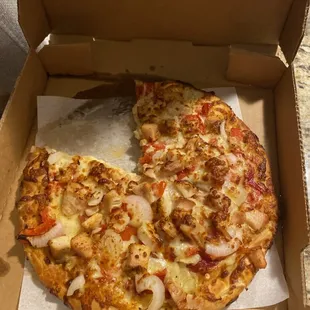a pizza in a cardboard box