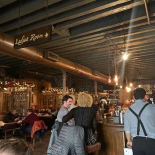 a crowd of people at a bar