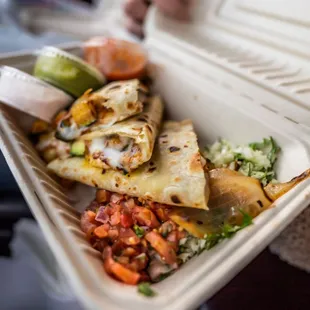  a person holding a takeout container