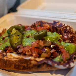  a sandwich in a styrofoam container