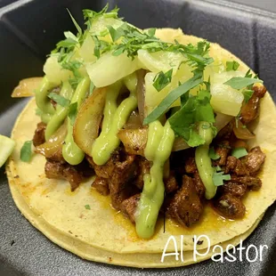 Baja style marinated pork, Grilled onions, avocado salsa, Pineapple, Cilantro