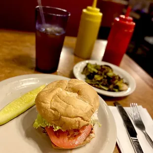 Plain Hamburger, iced tea and side special Brussels Sprouts