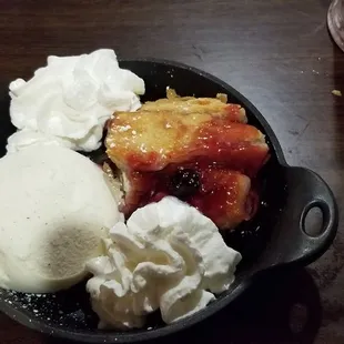 BlackBerry rhubarb with vanilla ice cream. Dinner was amazing but the dessert didn&apos;t wow me. It was just ok.