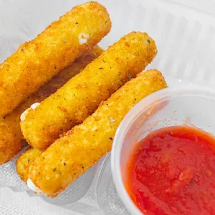 Gooey mozzarella sticks fried to a golden crispy perfection.