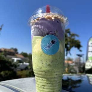 a cup of ice cream with a straw