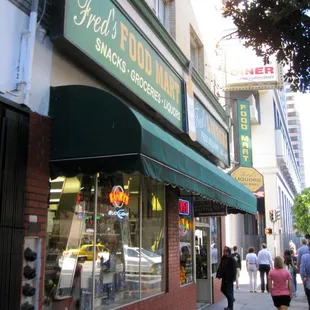 people walking down the sidewalk