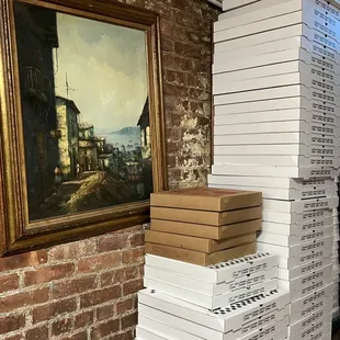 a stack of pizza boxes