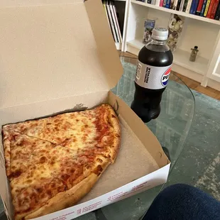 a slice of pizza in a box