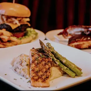 Grilled Salmon with garlic mash and grilled asparagus, Bacon cheese burger with cut fries, 1/3 slab of ribs.