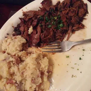 Amazing and tender brisket with garlic mashed potatoes