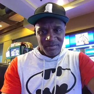 a man wearing a batman t - shirt