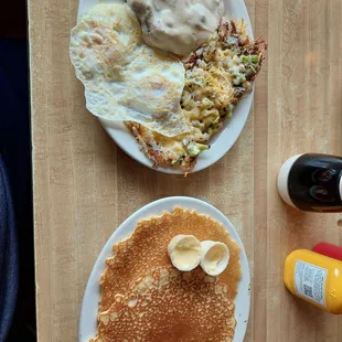 Country fried steak,  eggs over medium, covered hashbrowns and pancakes.