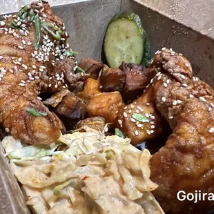 Gojira $13 (Gochujang Honey Tenders, Banchan Cucumbers, Kimchi Slaw, Crispy Sweet Potatoes)