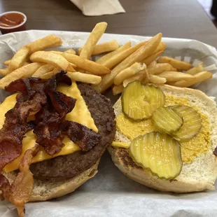 Bacon Cheese Burger with mustard and pickles. Hadn&apos;t eaten here since we moved offices as we were next door. Great burger !!!