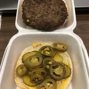 Double-meat Cheeseburger with mustard, pickles, and jalapeños